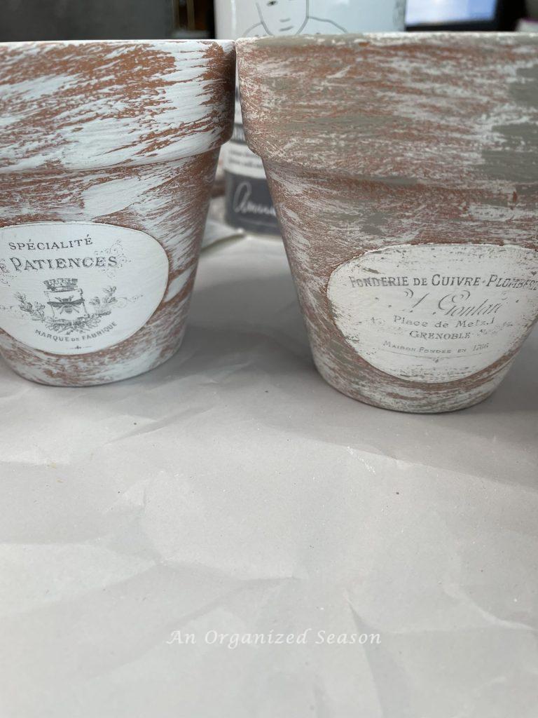 Add gray paint, showing step two for how to age terra cotta pots & add French flair.