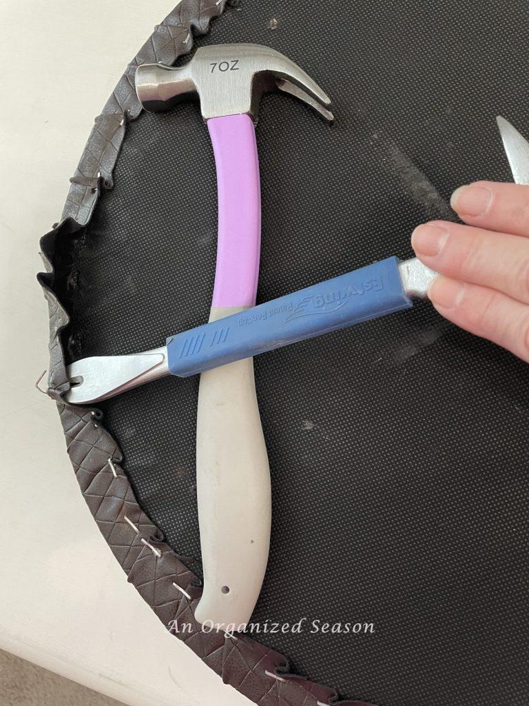 Step two to reupholster seats and stools, is to remove the old fabric.