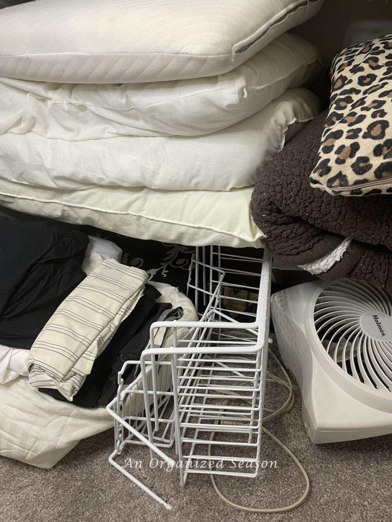 Take advice for organizing a linen closet and remove cluttered linens.
