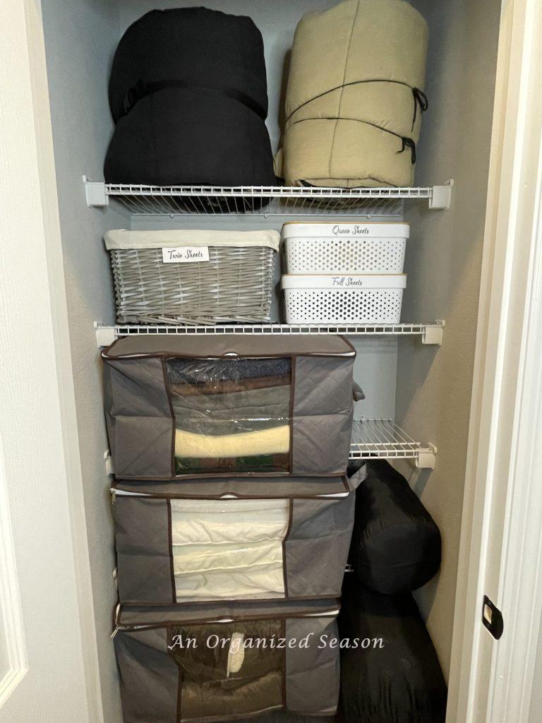 Take advice for organizing a linen closet. and use storage bags and tubs.