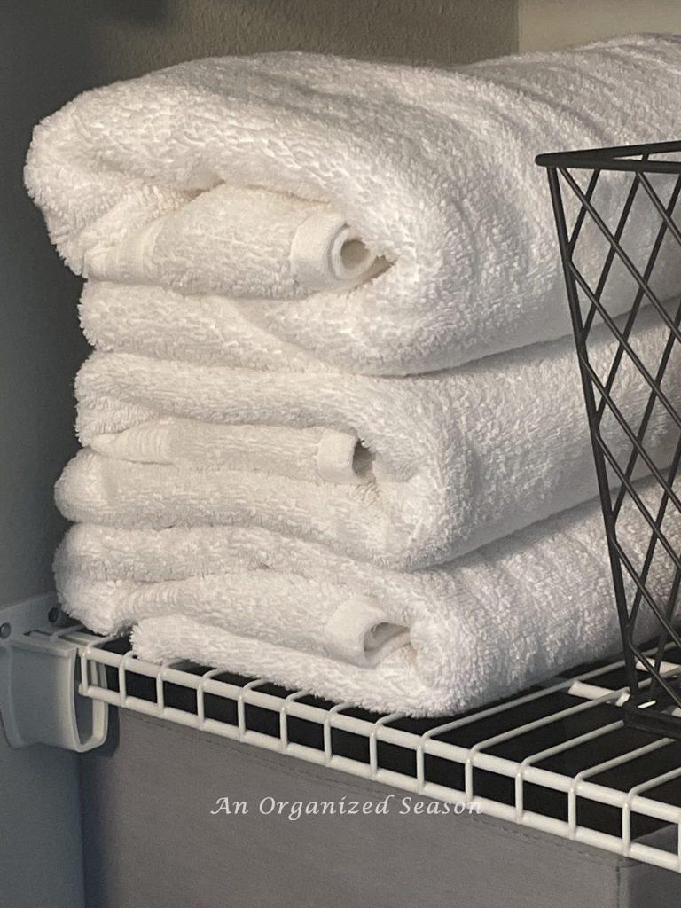 My best advice for organizing a linen closet is to fold towels uniformly.