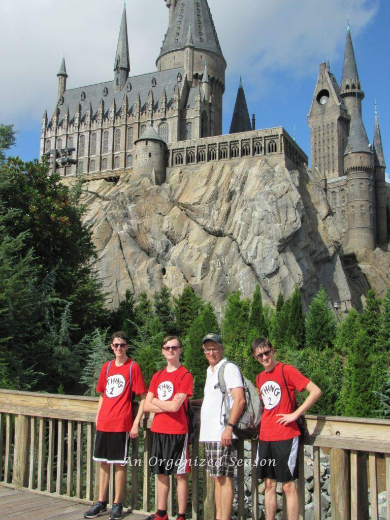 A dad and his three sons at a theme park on Father's day!