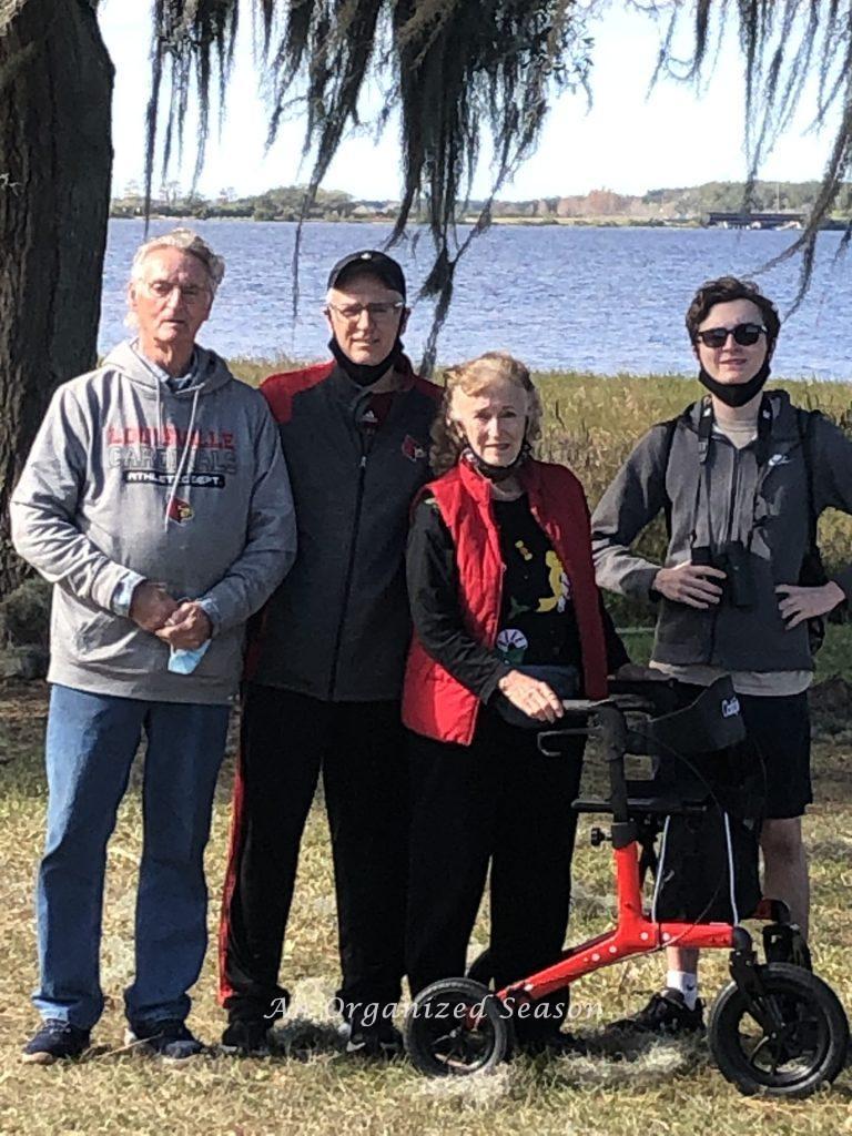 A dad with his son and Grandson by a lake on Father's Day.