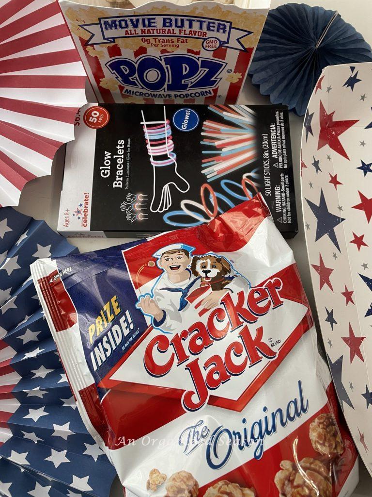 Use glow bracelets, Cracker Jacks, and popcorn to make a bang with a 4th of July gift tray!