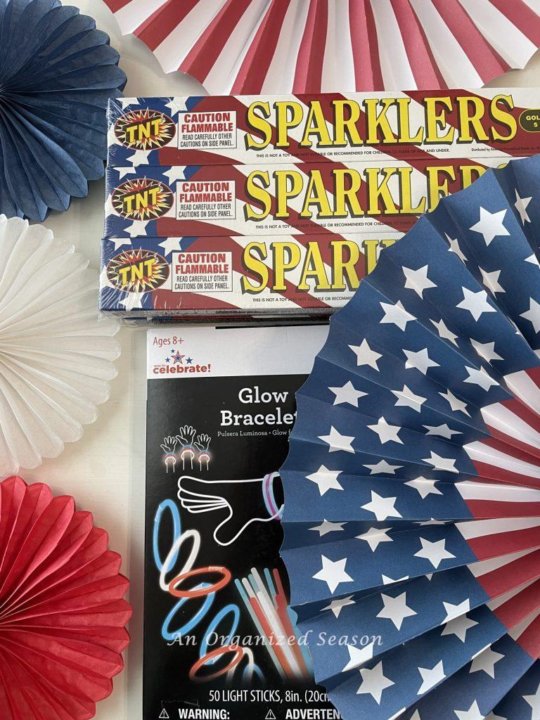 Sparklers and glow bracelets will  make a bang in a 4th of July gift tray! 