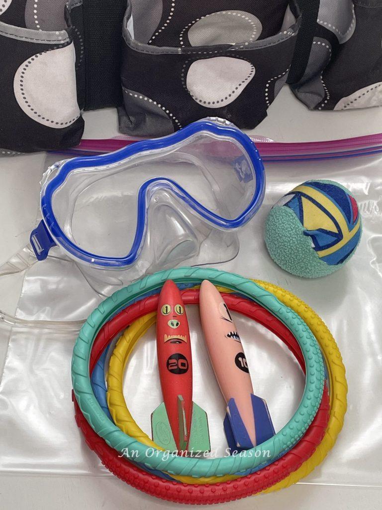 Eighth practical tip to organize a pool bag, add pool toys.