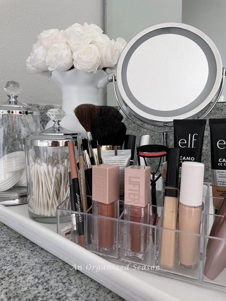 A bathroom vanity holding a clear organizer full of make-up, showing part of my morning routine. 