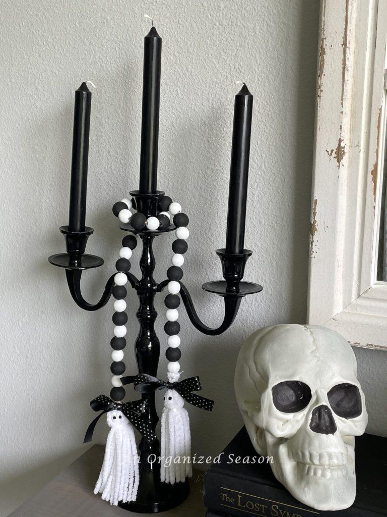 Black and white wood bead garland with ghost tassels is a great DIY Fall decor craft.