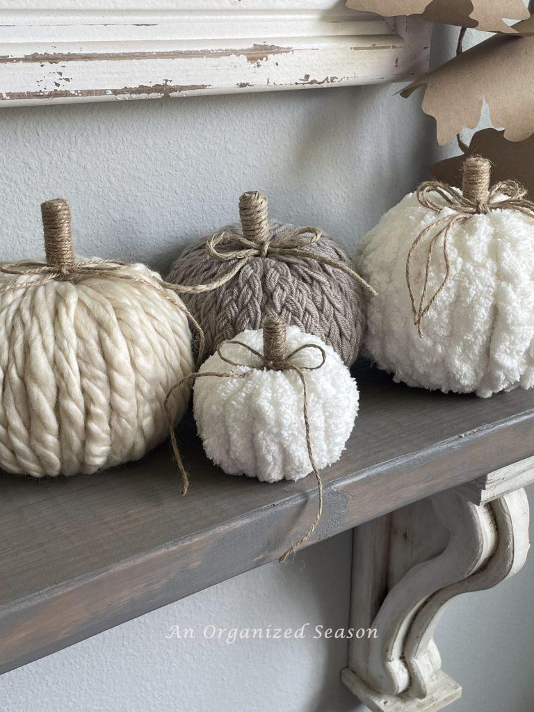 Another great DIY Fall decor craft is these yarn covered pumpkins with jute twine stems.