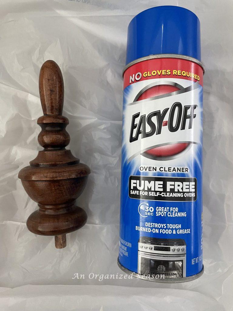 A wood finial and can of Easy-Off Oven Cleaner used to strip and bleach wood furniture.