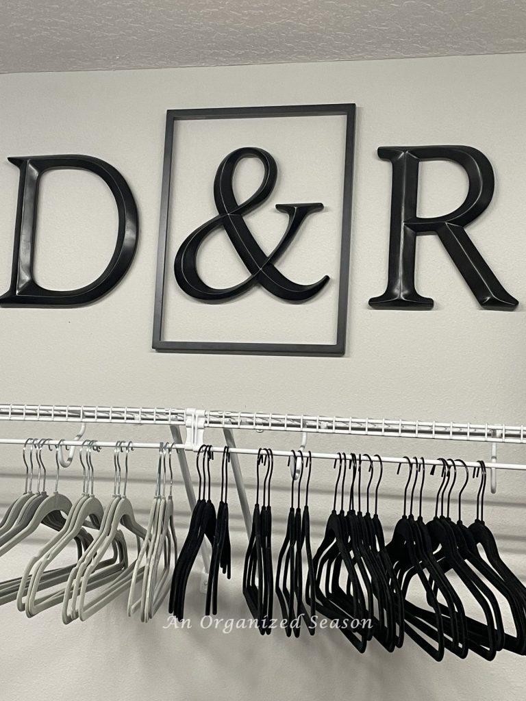 Empty hangers in a closet after a clothes purge. 