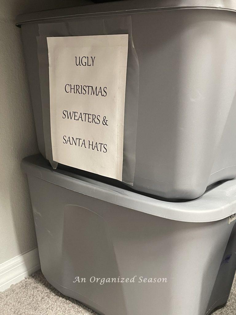 Two plastic tubs in a closet showing how to store clothes after you purge them. 