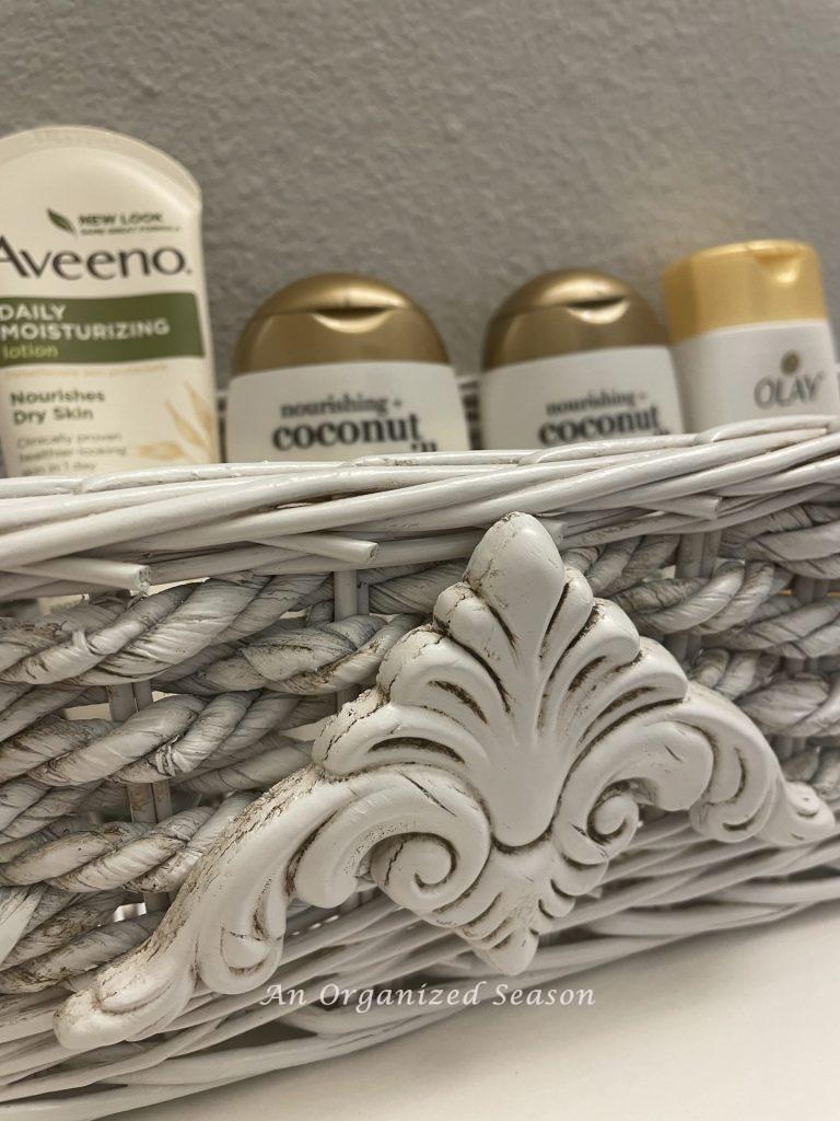 Fill a basket with toiletry items to organize a guest bath.