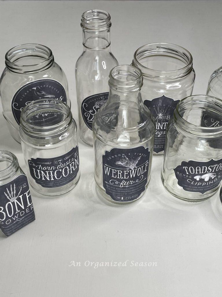 Clear jars with black and white labels, used to make spooky potion bottles!