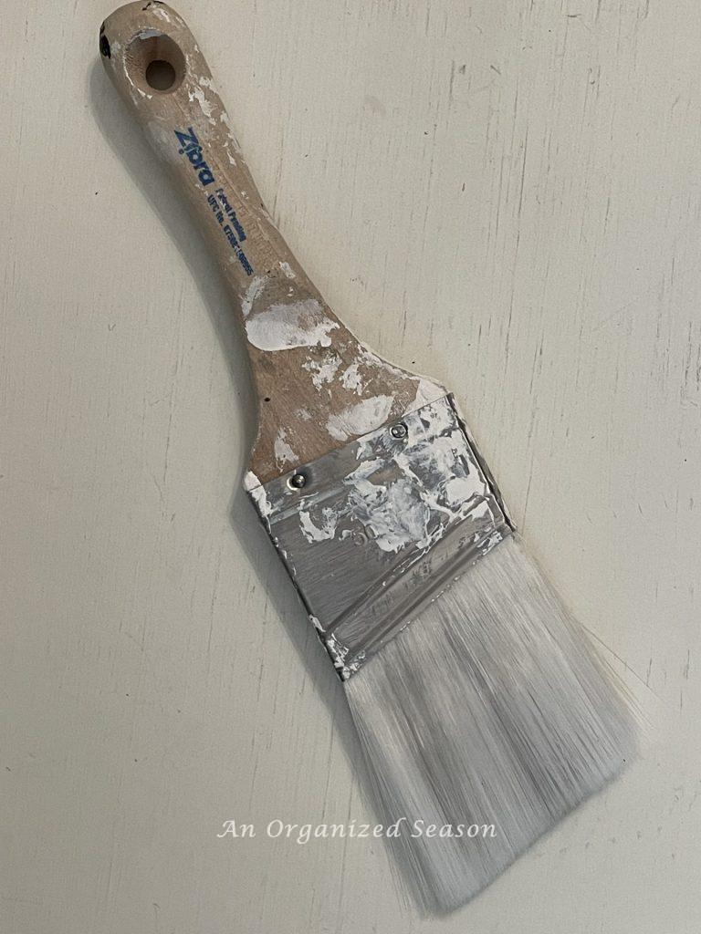 A Zibra paint brush that has been used many times. 