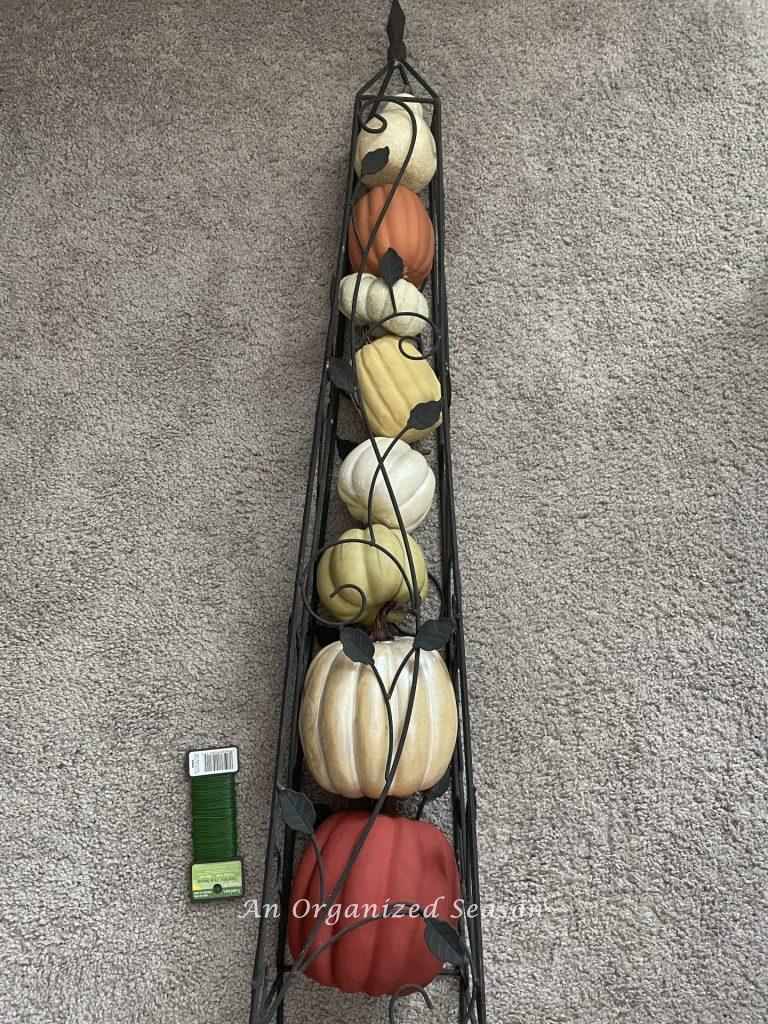 Pumpkins stacked inside an obelisk.