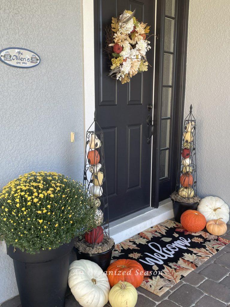 Home entrance decorated for fall. 