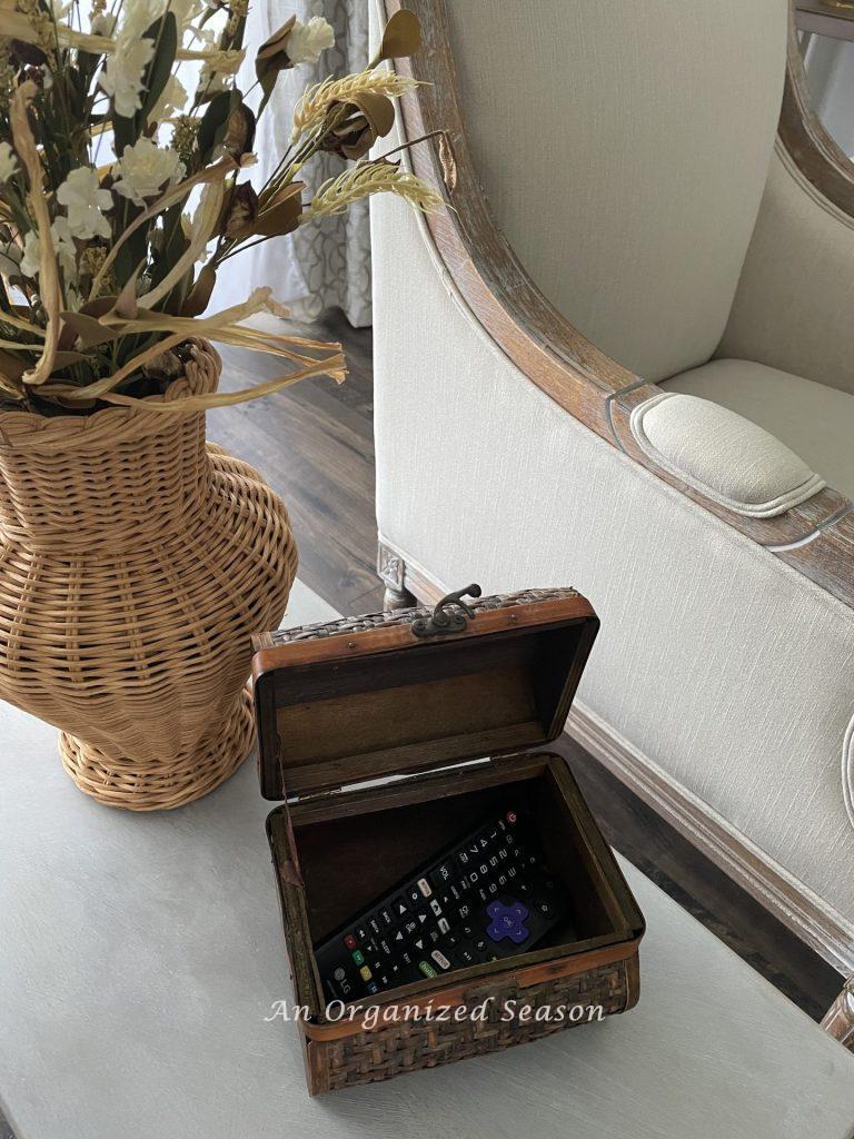 Tip one for to get your living room holiday ready is to store remotes inside a basket.