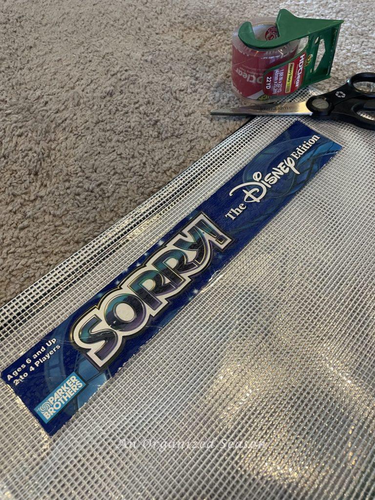 A plastic storage bag labeled with the side of the board game box. 