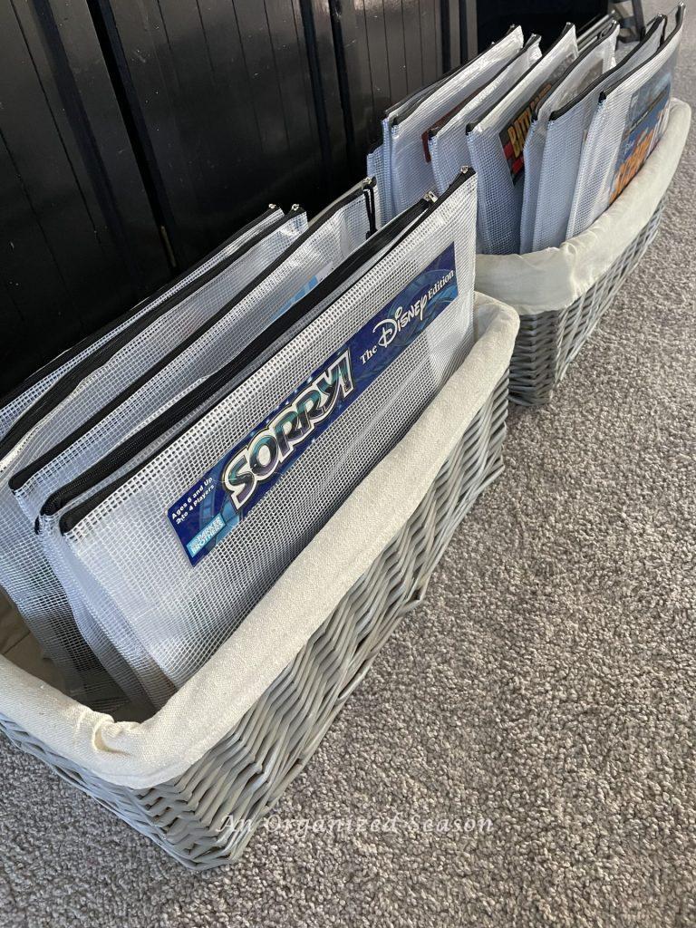 Board games that are stored in plastic zipper bags to organize them. 