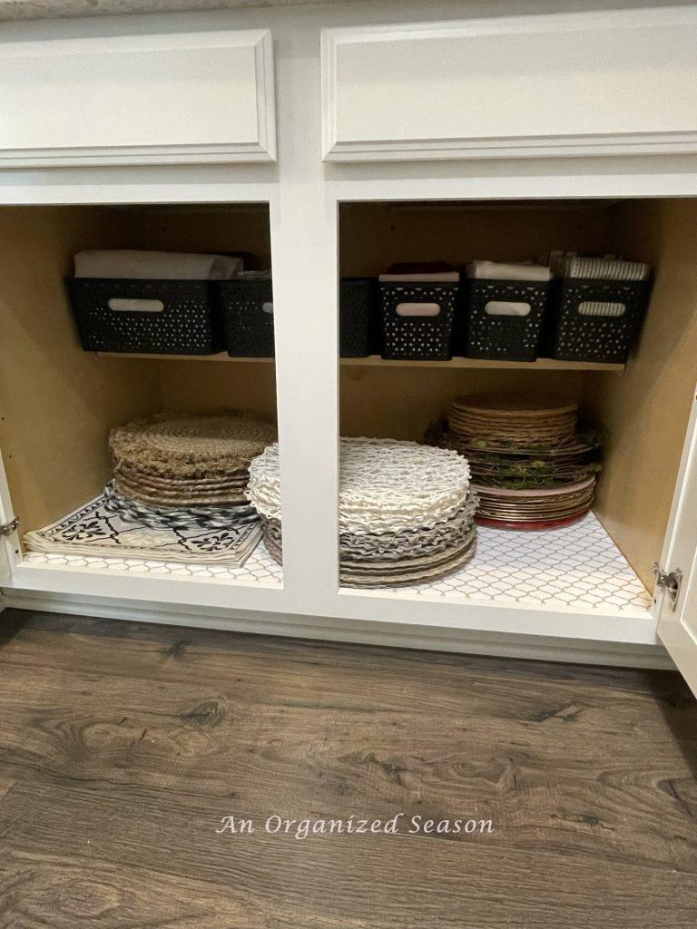 Declutter the dining room and put placemats and table linens in a cabinet. 