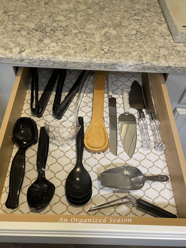 Store serving utensils in a drawer of the butler's pantry. 