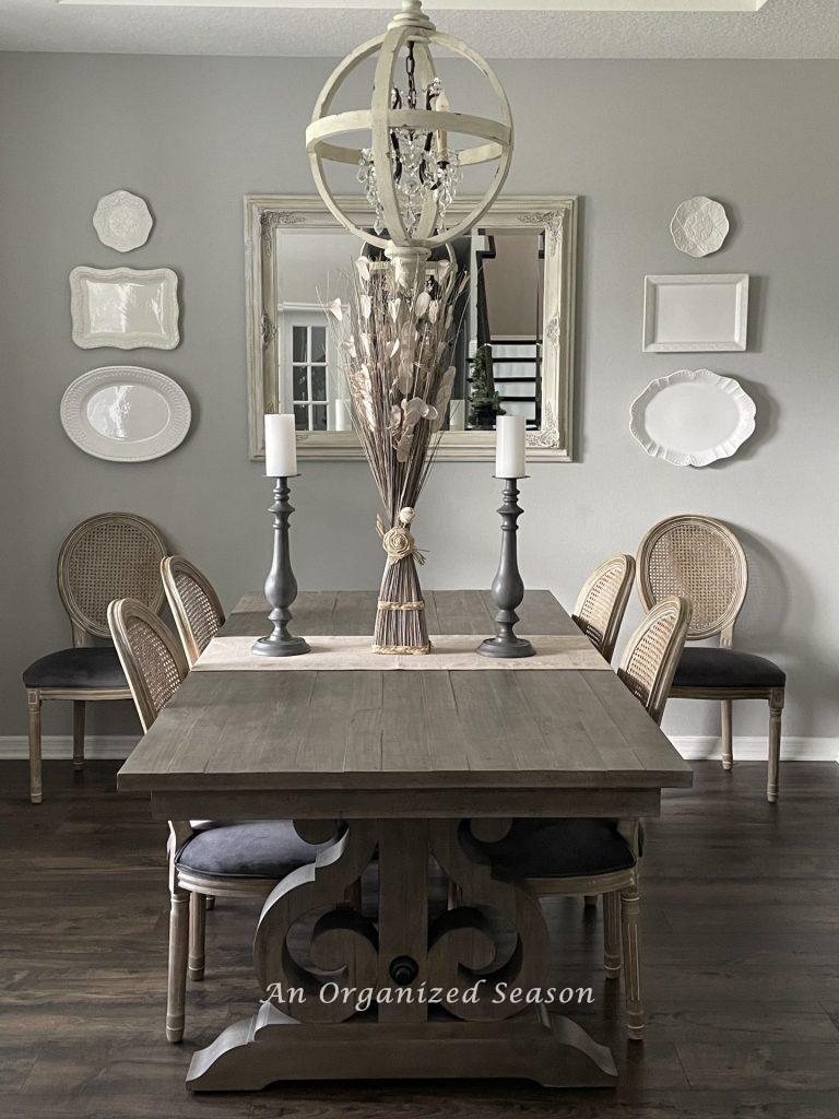 A gray and white dining room. 