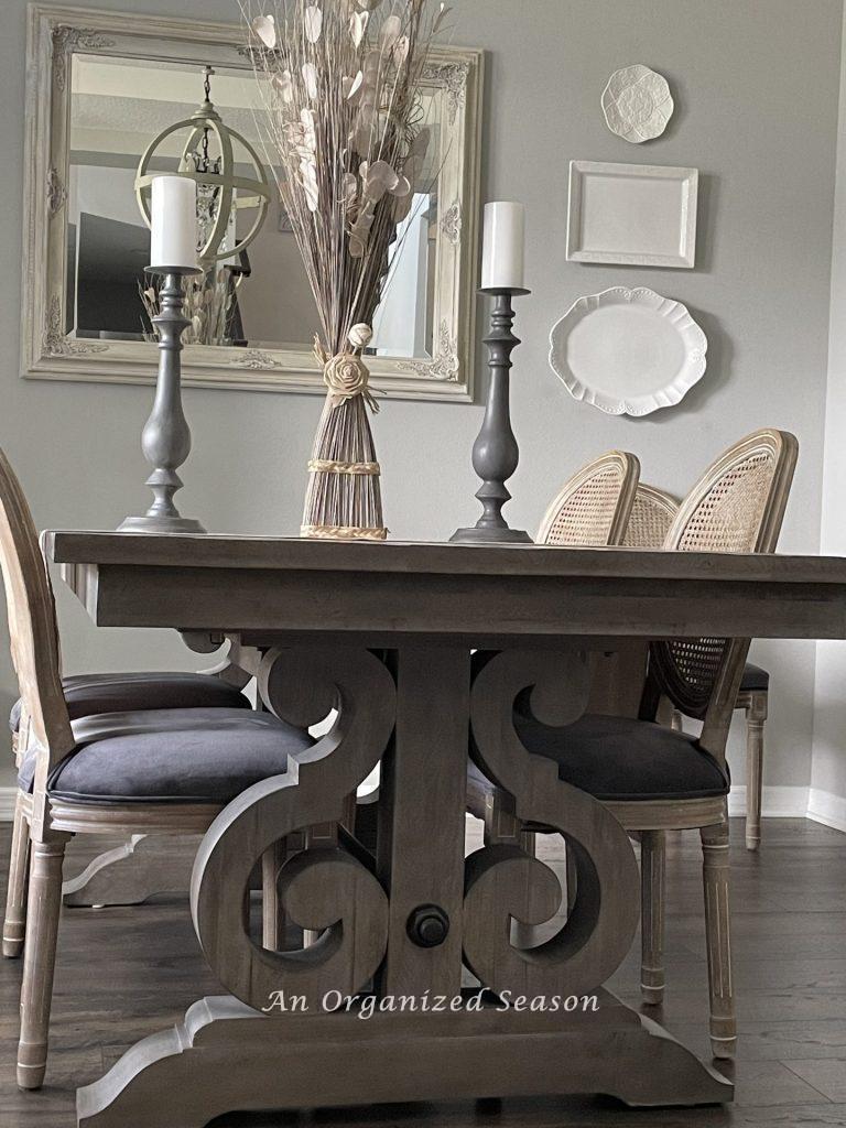 A dining room table with swirled decorative legs.