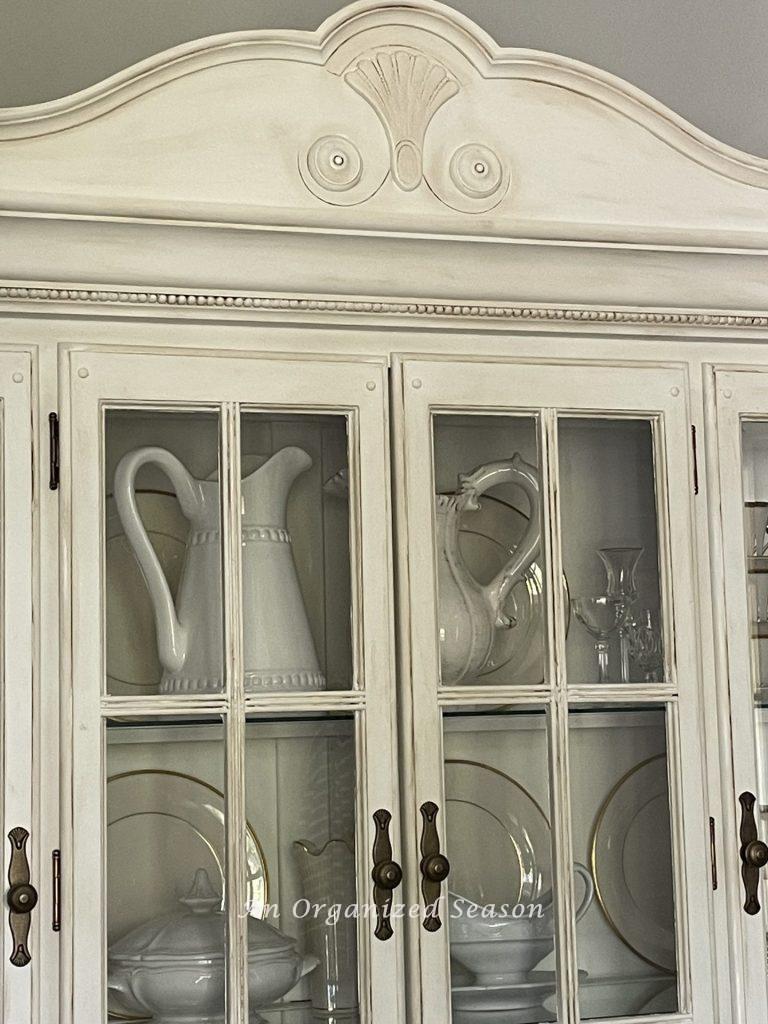 White dishes displayed in a china cabinet! 