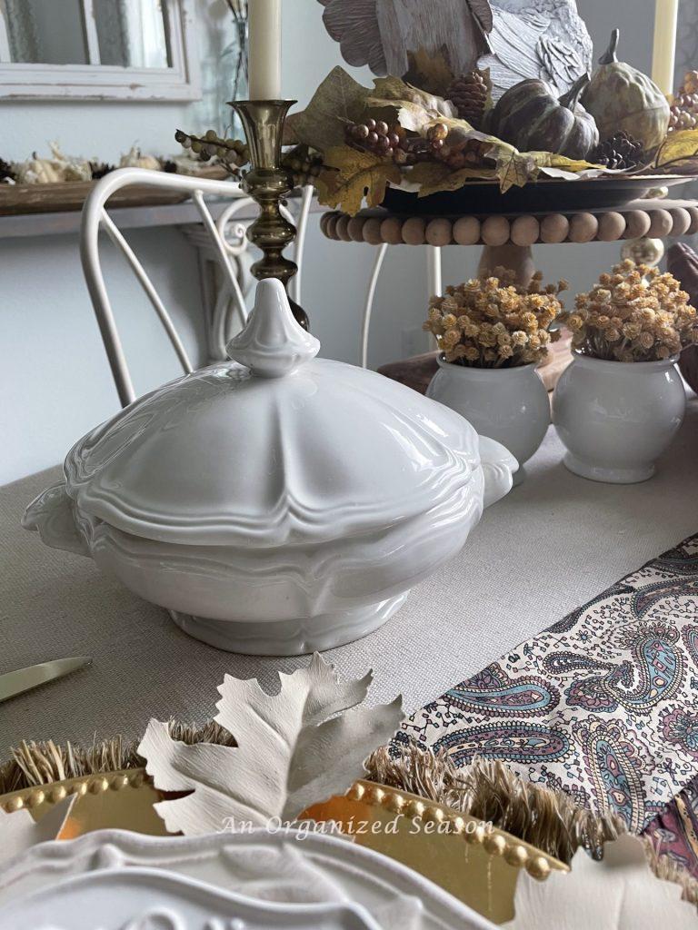 Using an ironstone casserole dish, great ideas for a thrifted Thanksgiving table.
