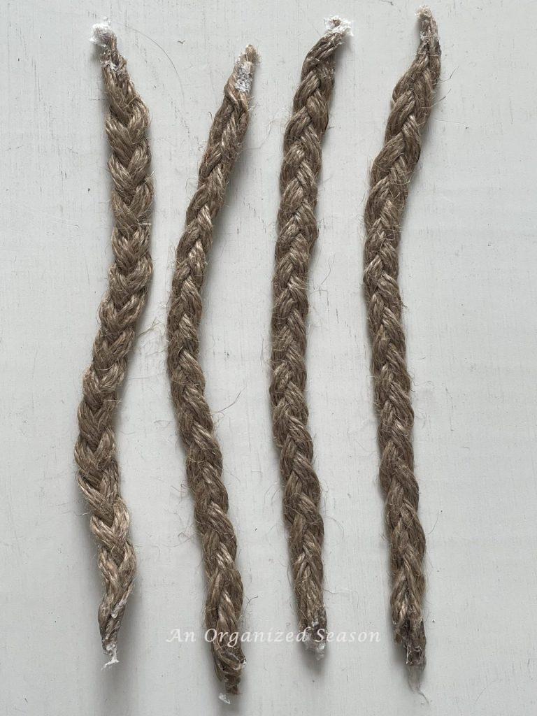 Four nine inch braids of jute twine. 