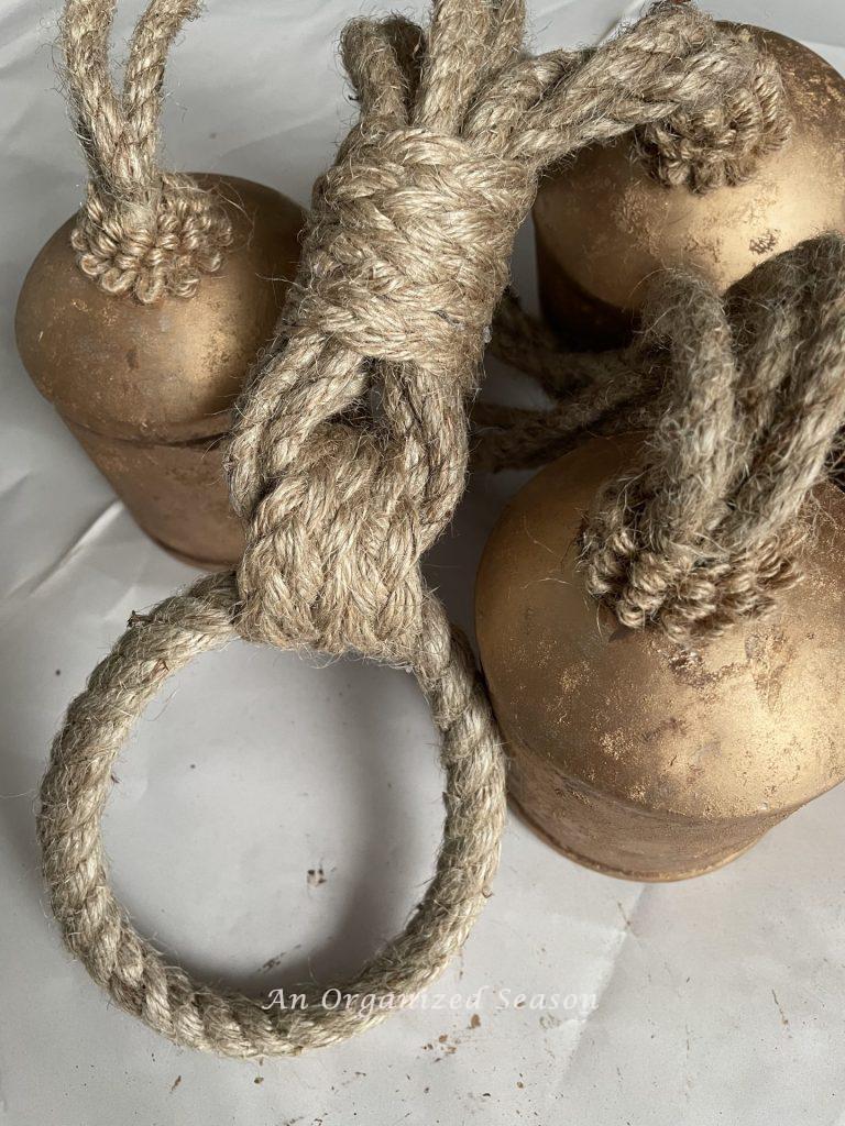 Jute twine braids wrapped around the cords of the bells. 