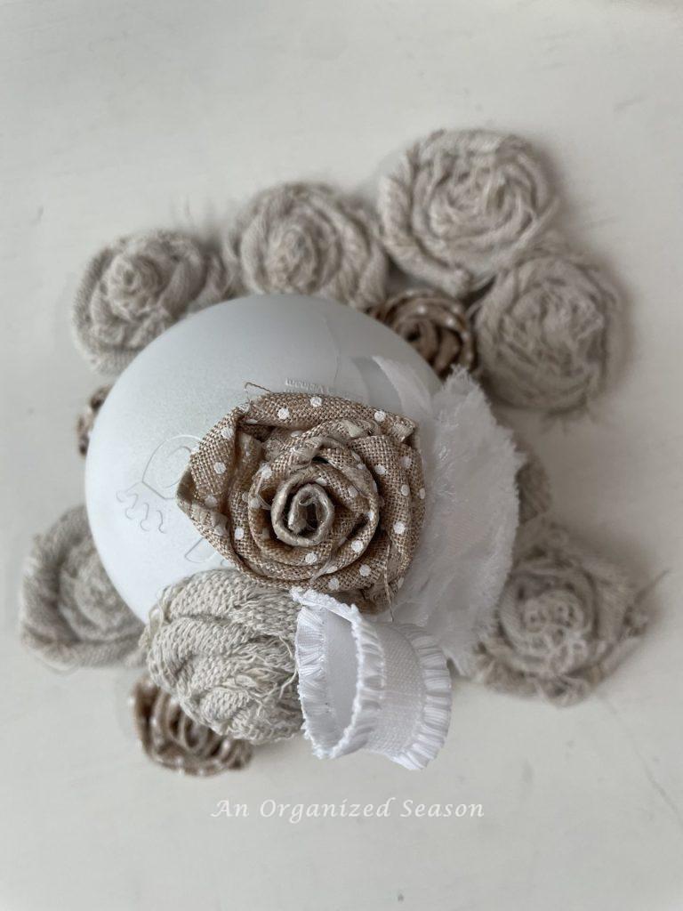 Hot glue rosettes onto a ball to make vintage Christmas ornaments. 