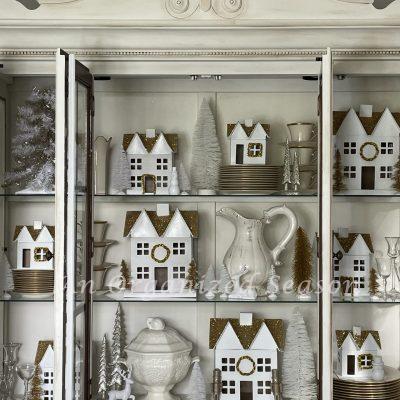 How to Style a Christmas Village in a China Cabinet