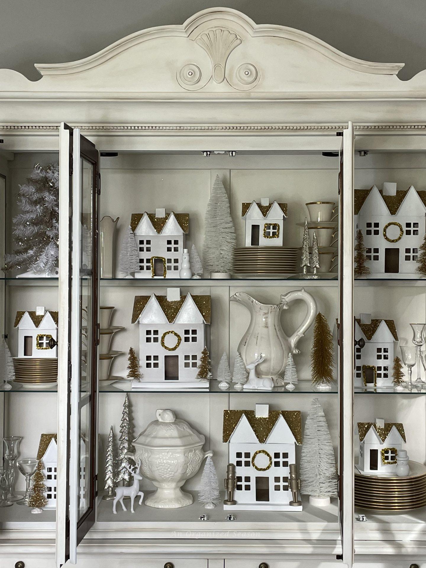 How to Style a Christmas Village in a China Cabinet - An Organized Season