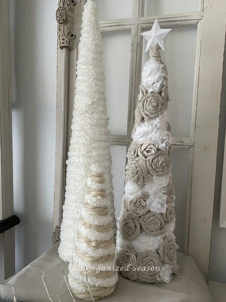 Cone Christmas trees made with yarn, drop cloth pieces, and ribbon. 
