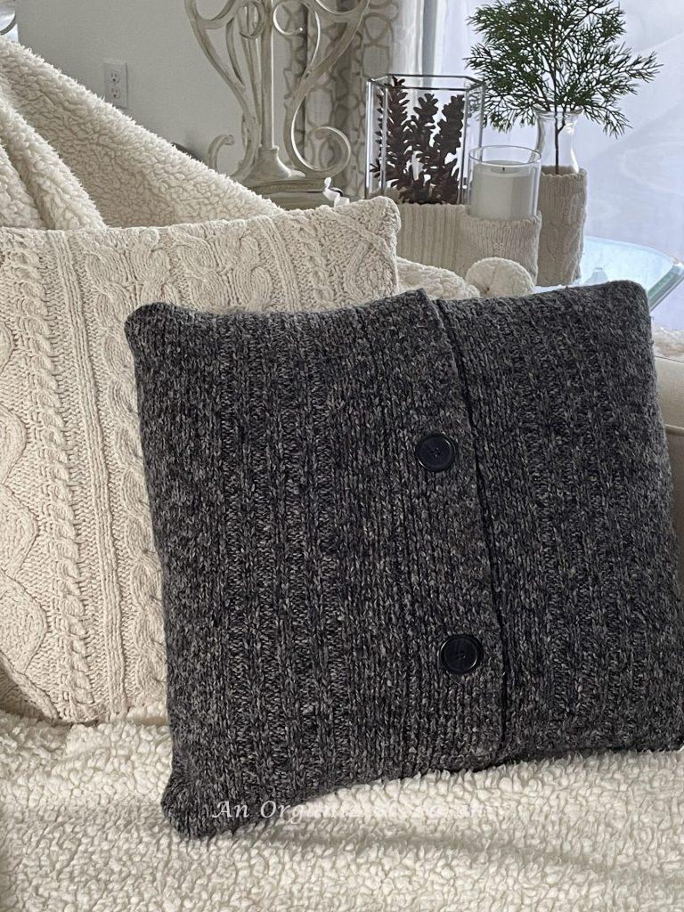 Two pillows made out of sweaters are a perfect example of  Winter decor ideas that don't look like Christmas!