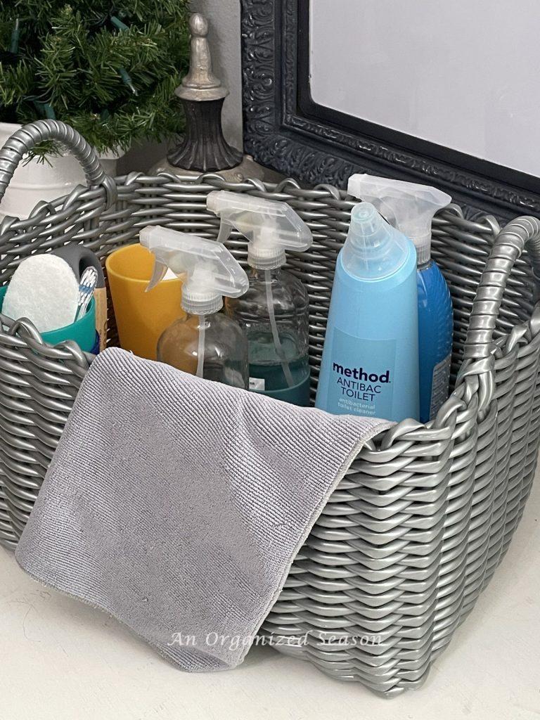 Organize your cleaning supplies in a basket to make life happy and healthy. 