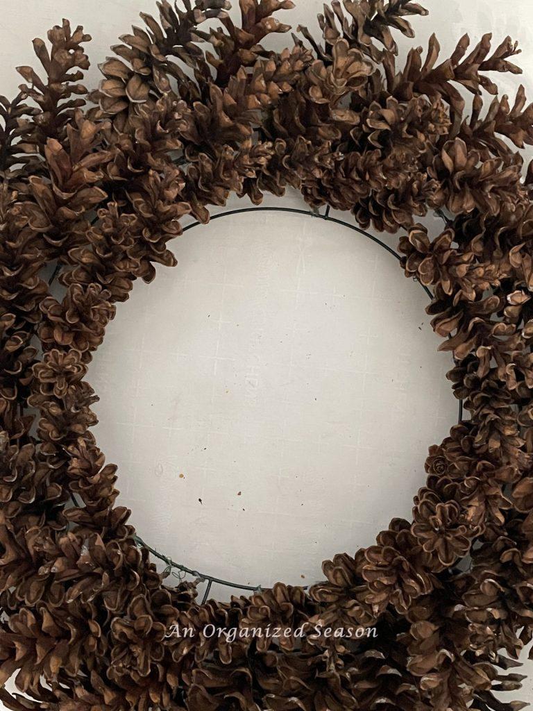 An amazing winter wreath made of pinecones.