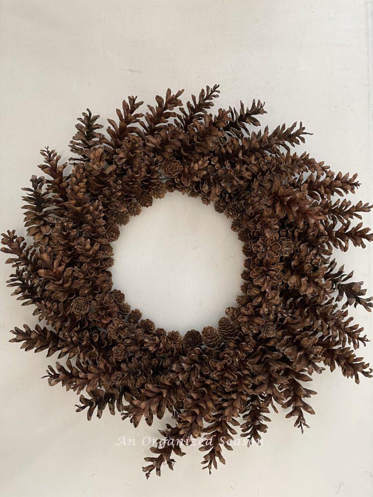 A beautiful wreath made from pinecones. 