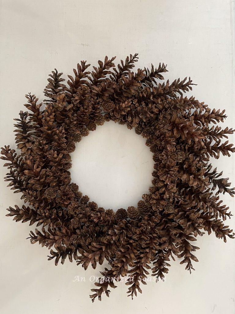 A beautiful wreath made from pinecones.