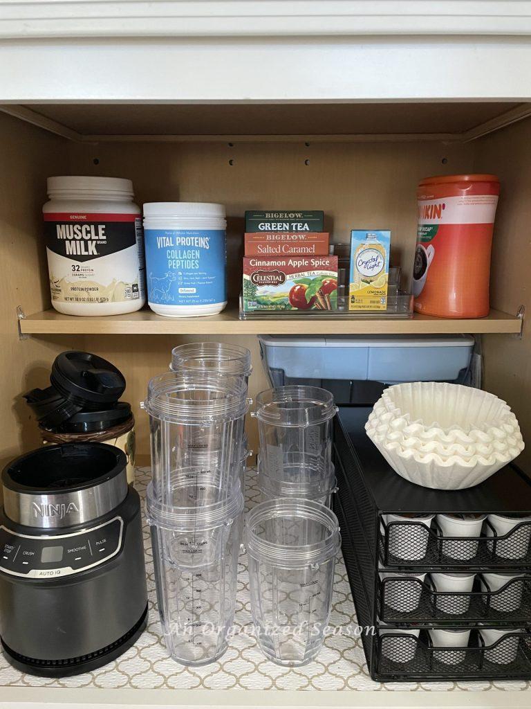 Organized coffee and tea in a kitchen cabinet. 