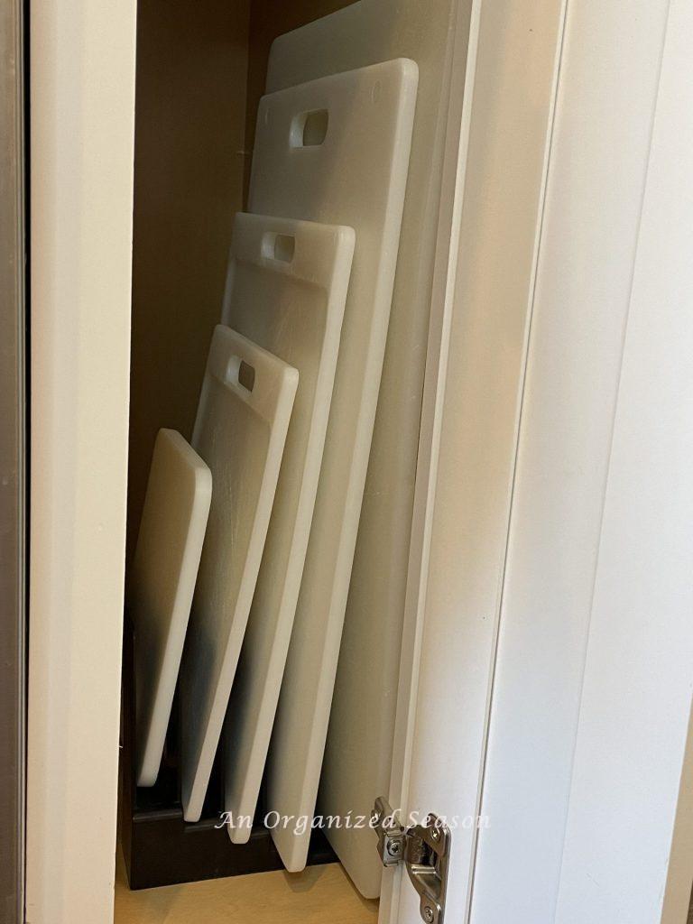 Kitchen storage solution number eight is to use an office incline file sorter to store cutting boards in a kitchen cabinet.  