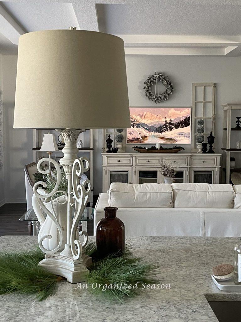 A white lamp on a kitchen counter.