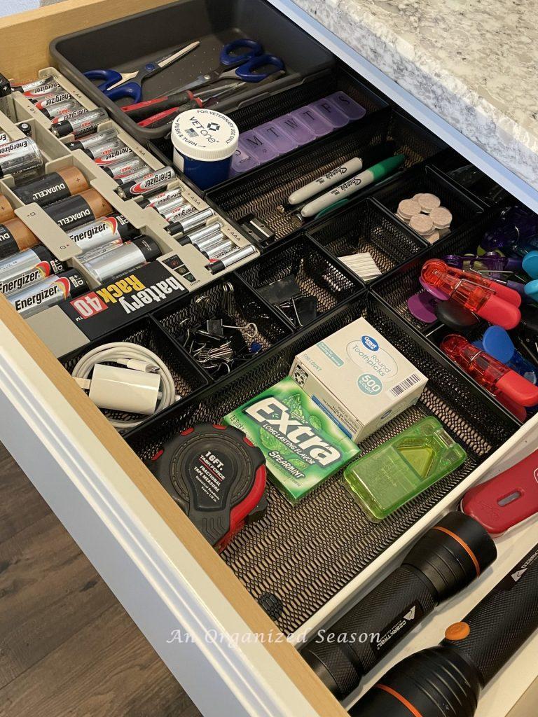 An organized kitchen junk drawer.