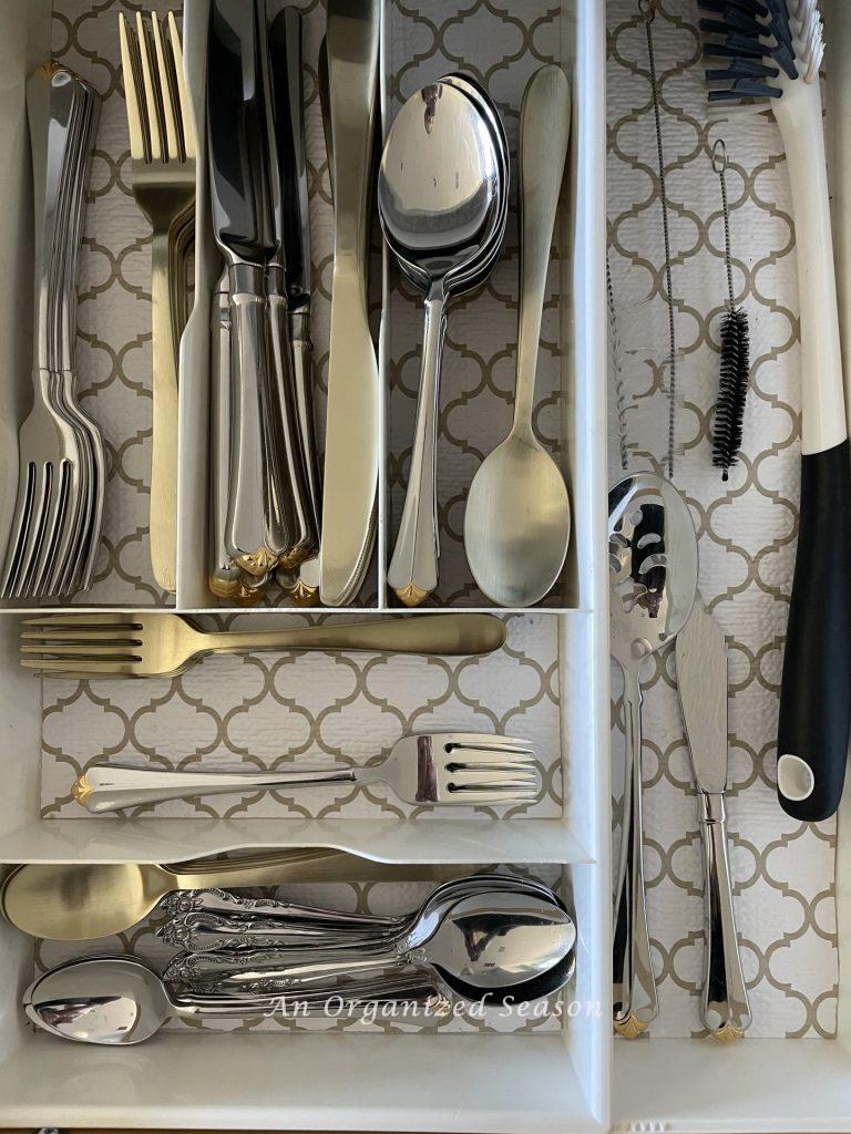 Kitchen storage solution number two is to use a divided drawer organizer to separate your eating utensils. 