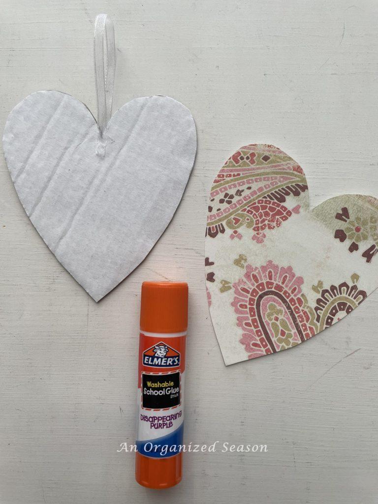 Two hearts, and a glue stick used to make cute Valentine's decor.