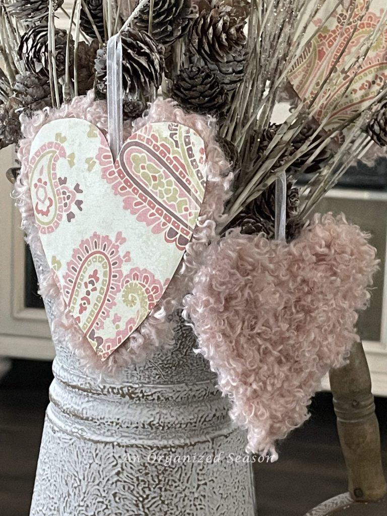 Hearts made from paper and yarn make cute Valentine's decor. 