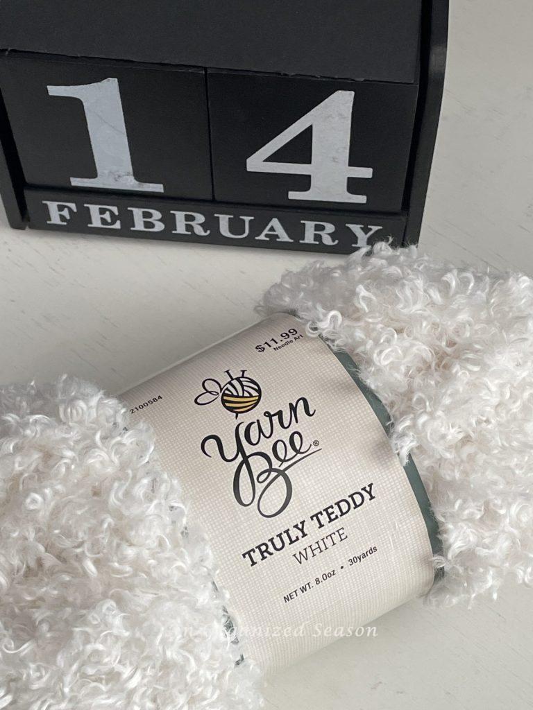 White Teddy Bear yarn used to make a Dollar Tree heart DIY topiary.