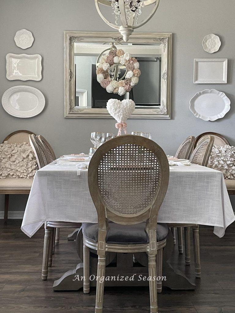 A dining room decorated for Galentine's Day.